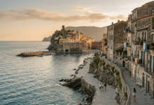 A tranquil view of a scenic coastal landscape with historic architecture in an emerging travel destination during golden hour.