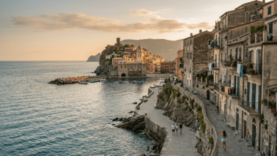 A tranquil view of a scenic coastal landscape with historic architecture in an emerging travel destination during golden hour.