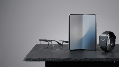 Tech Products . A high-tech studio table displaying prototype smart glasses, a foldable mobile display, and a sleek next-generation smartwatch under professional studio lighting..png